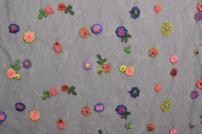 Image of embroidered tulle fabric with flowers - black shade 70 g/m² – available at Šarlotes audumi
