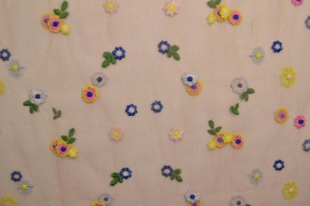 Image of embroidered tulle fabric with flowers - peach tone 70 g/m² – available at Šarlotes audumi