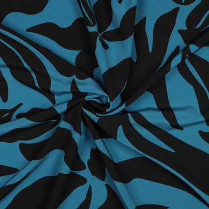 Image of dress fabric with elastane - mottled pattern on a petrol background 80 g/m² – available at Šarlotes audumi