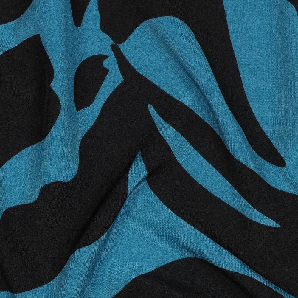 Image of dress fabric with elastane - multicolored pattern on a petrol background 80 g/m² – available at Šarlotes audumi