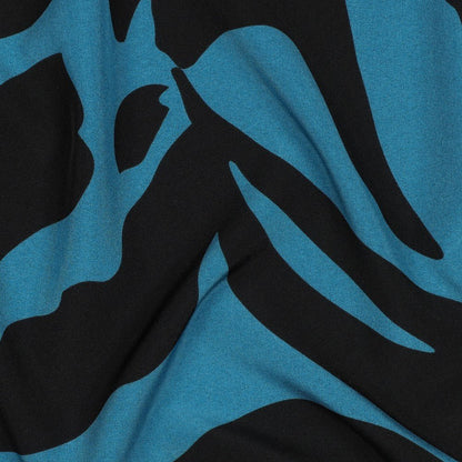Image of dress fabric with elastane - multicolored pattern on a petrol background 80 g/m² – available at Šarlotes audumi