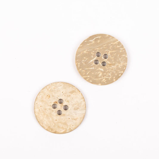 Image of a DROPS coconut button, 25 mm – available online at Šarlotes audumi