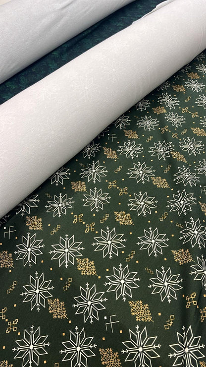 Cotton loopback knit fabric with morning stars on a dark green background 250 g/m² – available at Šarlotes audumi