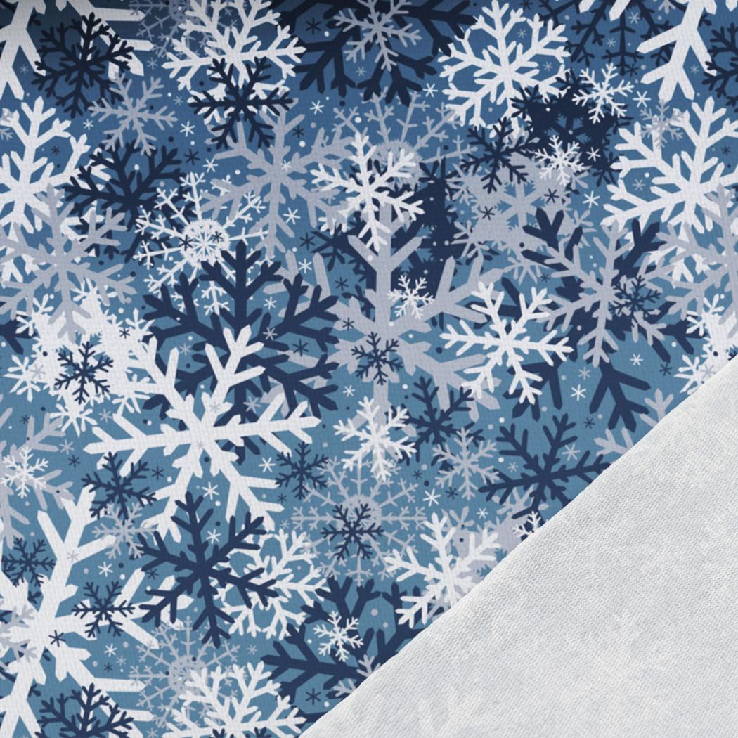 Image with cotton loopback knit – snowflakes on a blue background 250 g/m² – available at Charlotte's Fabrics