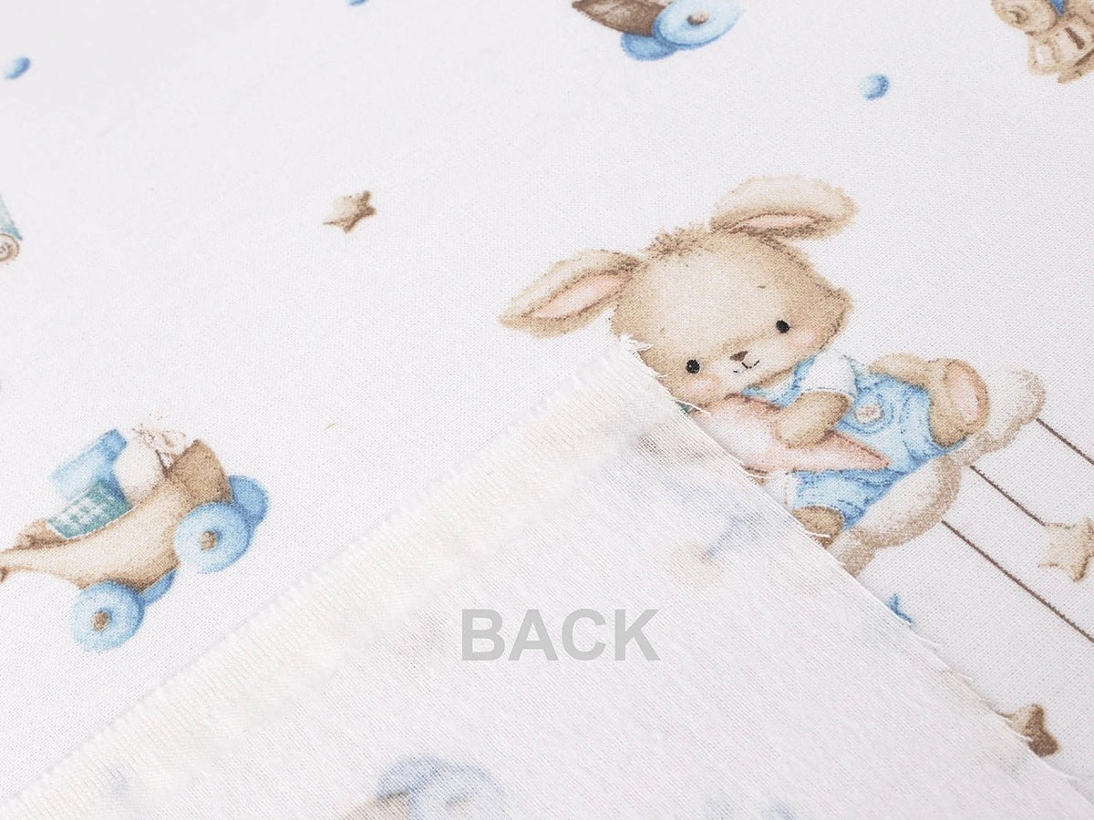 Image of cotton flannel with rabbits in blue accents – available online at Šarlotes audumi
