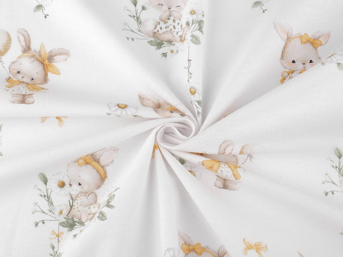 Image of cotton flannel with bunnies in yellow bows – 100% cotton – available online at Šarlotes audumi