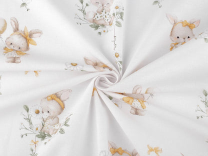 Image of cotton flannel with bunnies in yellow bows – 100% cotton – available online at Šarlotes audumi