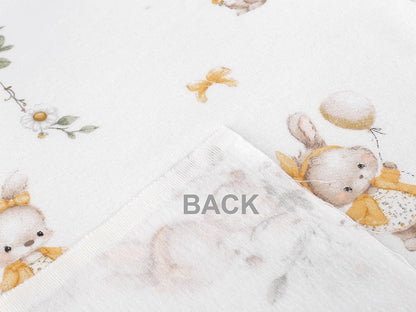 Image of cotton flannel with bunnies in yellow bows – 100% cotton – available online at Šarlotes audumi