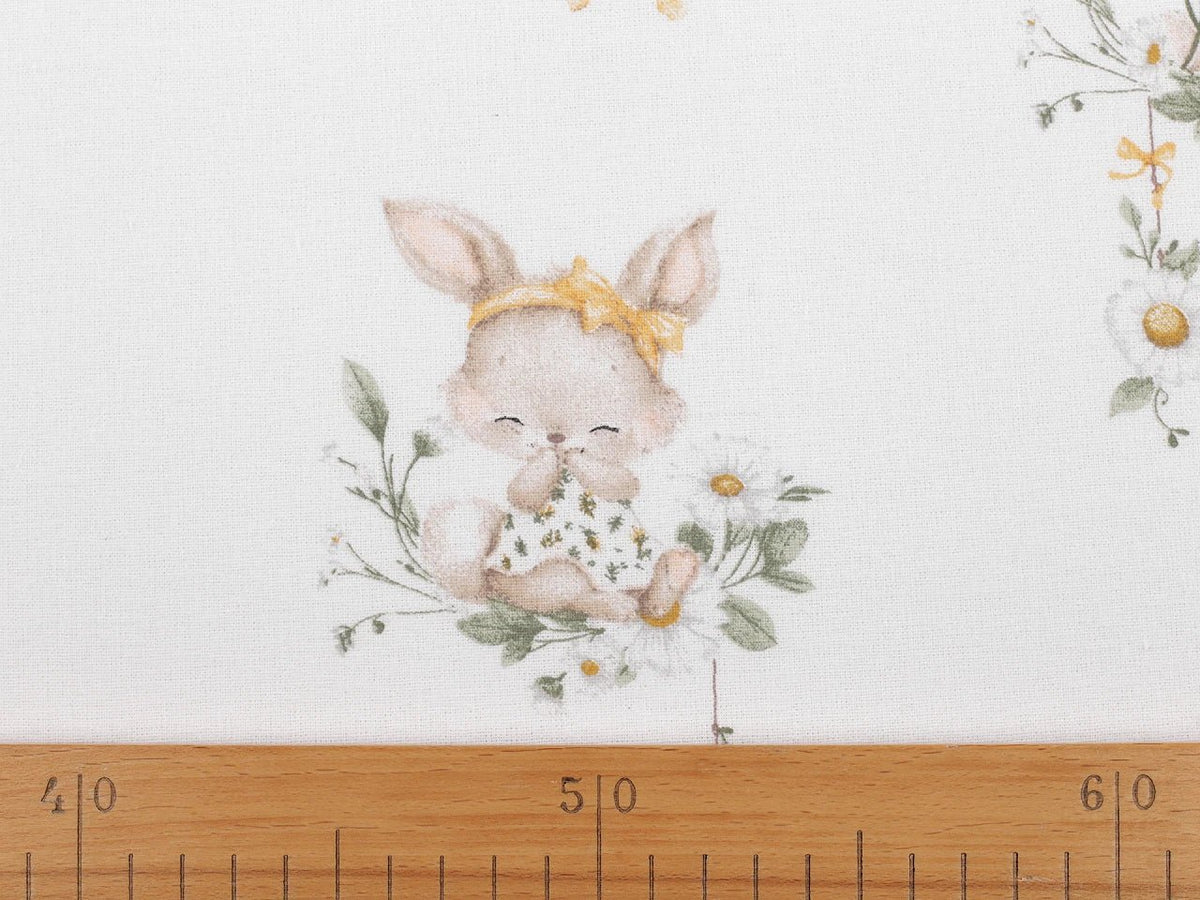 Image of cotton flannel with bunnies in yellow bows – 100% cotton – available online at Šarlotes audumi