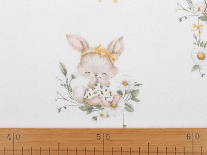 Image of cotton flannel with bunnies in yellow bows – 100% cotton – available online at Šarlotes audumi