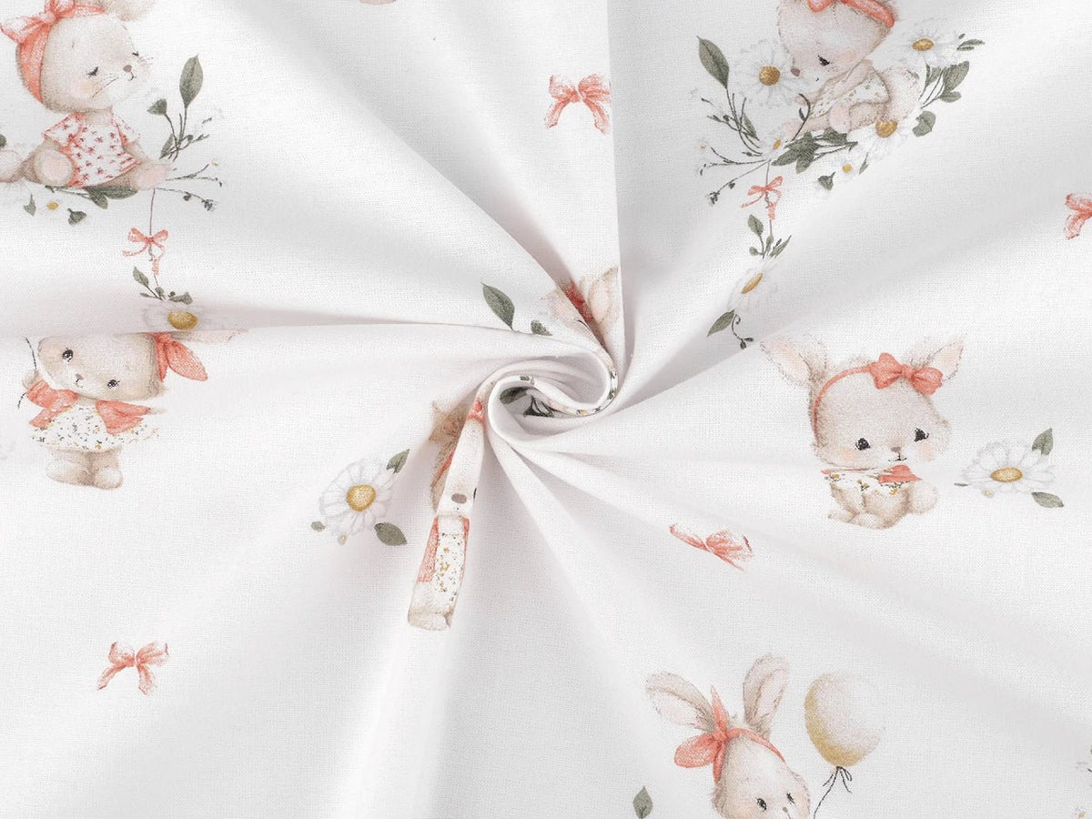 Image of cotton flannel with bunnies in pink bows – 100% cotton – available online at Šarlotes audumi