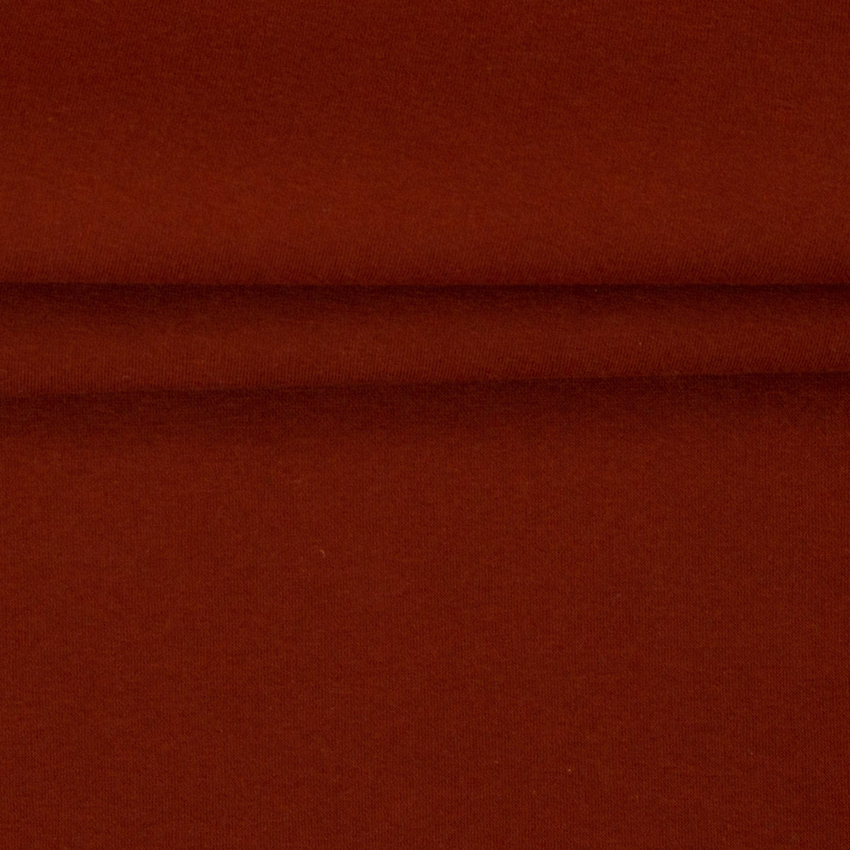 Image of terracotta cotton-lined knit fabric – available online at Šarlotes audumi