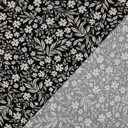Image of Cotton jersey - white flowers on black 200 g/m² – available at Šarlotes audumi