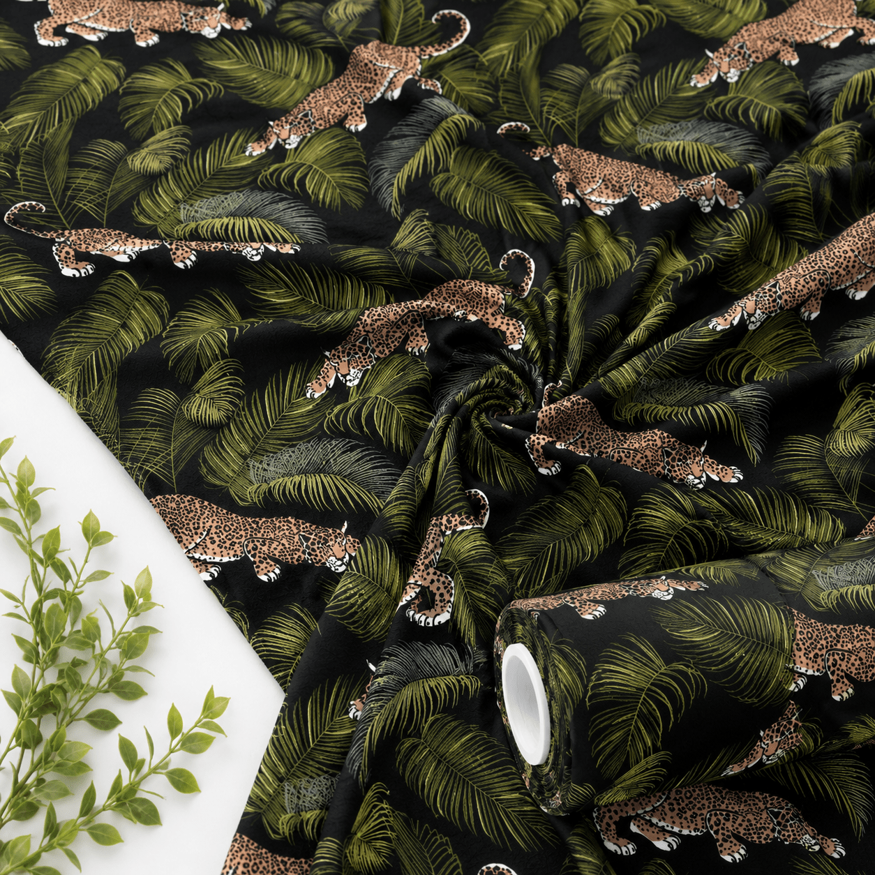 Image of cotton knit fabric - leaves and leopards 220 g/m² – available at Šarlotes audumi