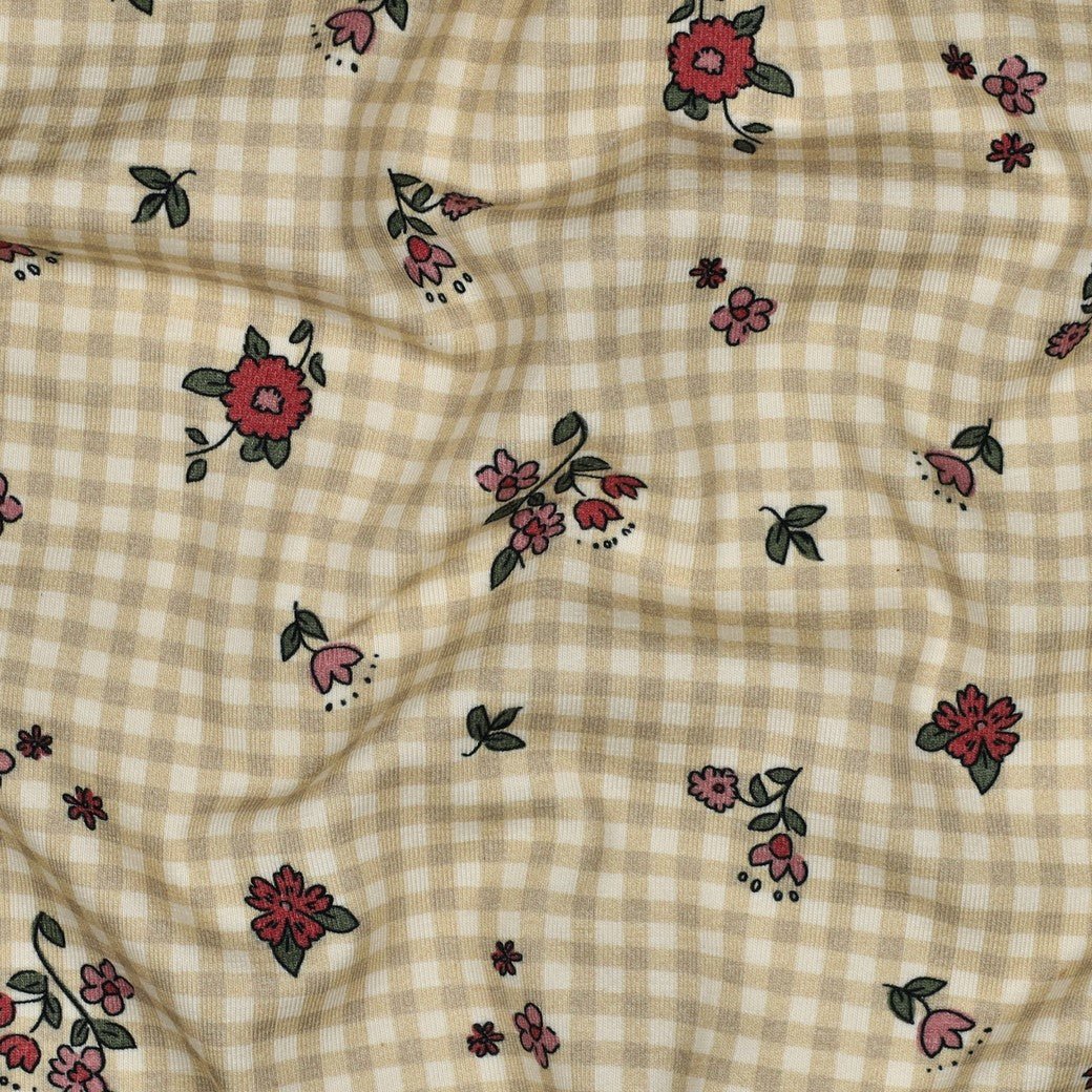 Image with cotton knit fabric - small flowers on a checkered background 220 g/m² (GOTS certified) – available at Šarlotes audumi