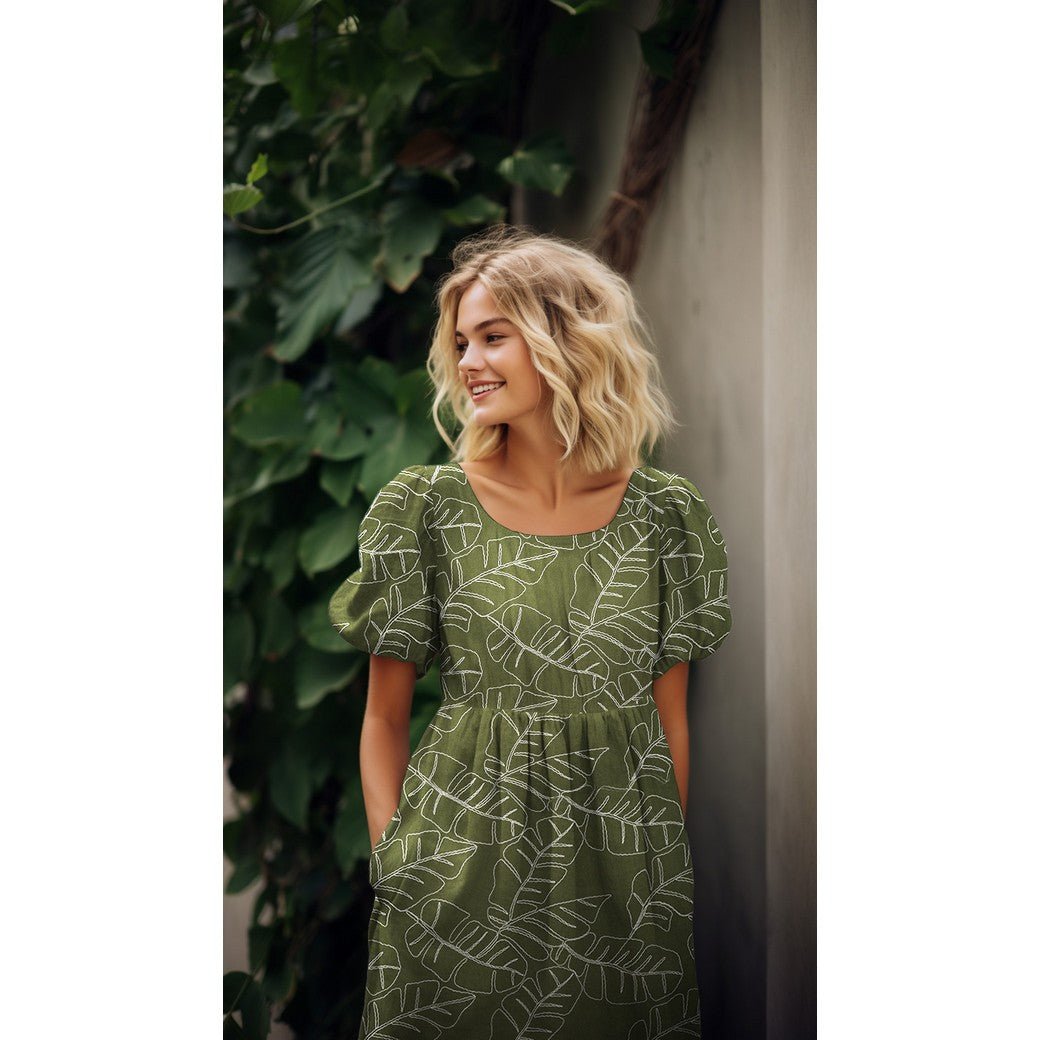 Image en lin avec des feuilles brodées en viscose sur fond vert 210 g/m² – disponible chez Šarlotes audumi