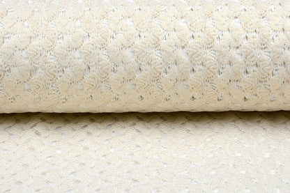 Tissu en dentelle blanc lait avec accents dorés 170 g/m²