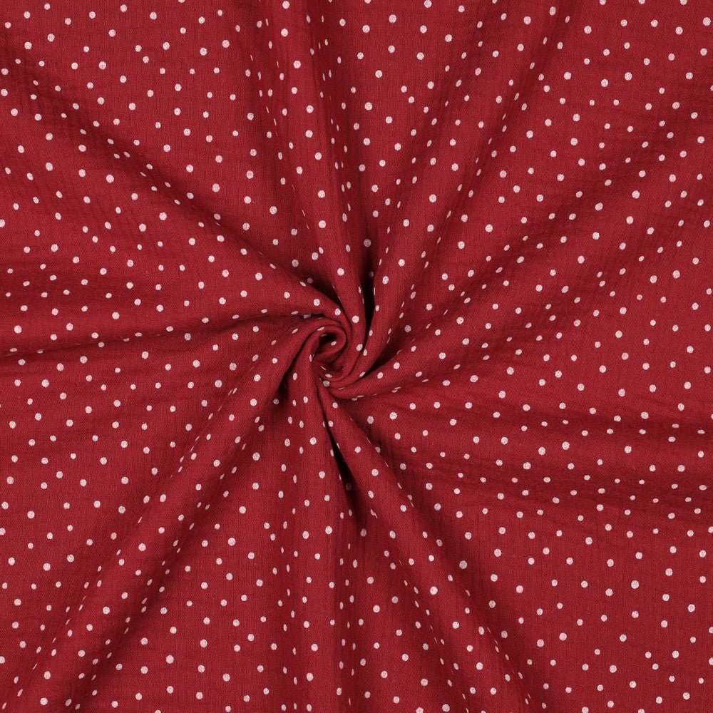 Muslin with dots on a dark red background 125 g/m² – available at Šarlotes audumi