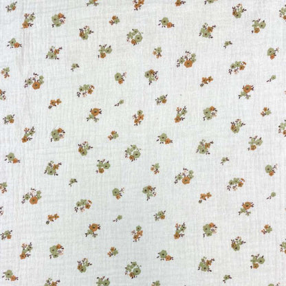 Muslin - flowers on an orange background 130 g/m²