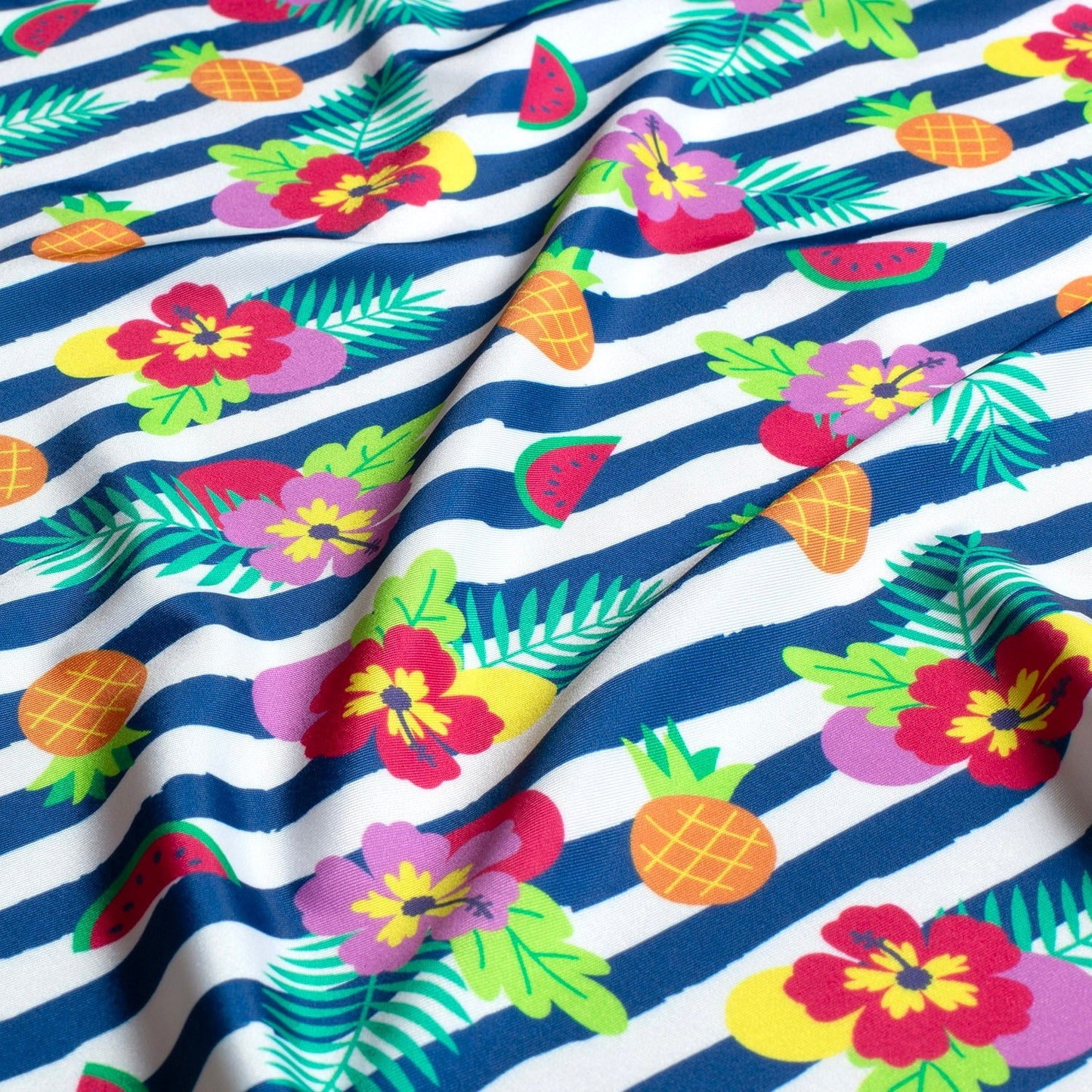 Image of swimwear lycra fabric with UPF50 protection – tropical stripe motif, 200 g/m² – available at Šarlotes audumi
