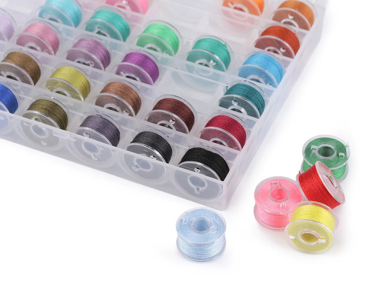 Image of a plastic box with thread spools – available online at Šarlotes audumi
