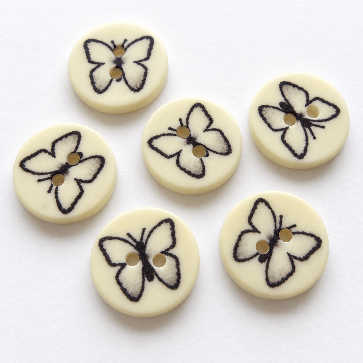 Image of plastic butterfly buttons 14 mm – available online at Charlotte's Fabrics
