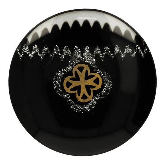 Image of a 19 mm black shank button with ornaments in the center – available at Šarlotes audumi