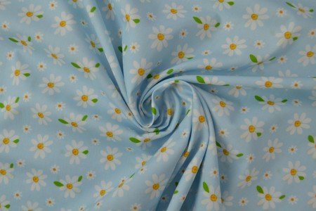Image of poplin daisies on blue – available online at Šarlotes audumi
