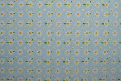 Image of poplin daisies on blue – available online at Šarlotes audumi