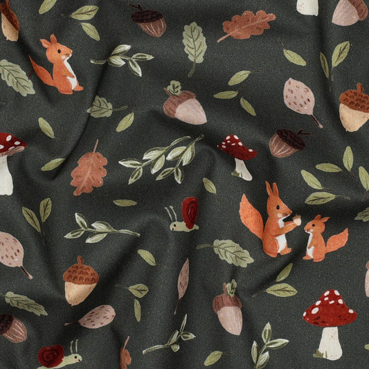 Image of premium 100% cotton fabric with an autumn motif on dark green – available online at Charlotte's Fabrics