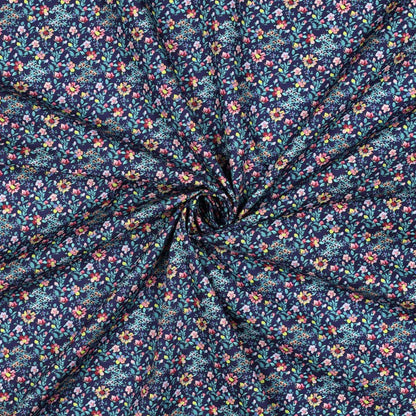 Image of Premium 100% cotton fabric with delicate flowers on dark blue – available online at Šarlotes audumi