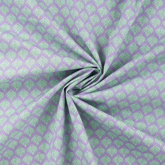 Image of premium 100% cotton fabric with turquoise leaves on a lilac background – available online at Šarlotes audumi