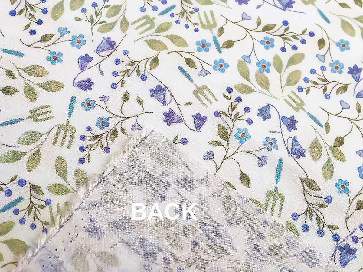 Image of premium lightweight 100% cotton fabric with blue flowers – available online at Charlotte Fabrics