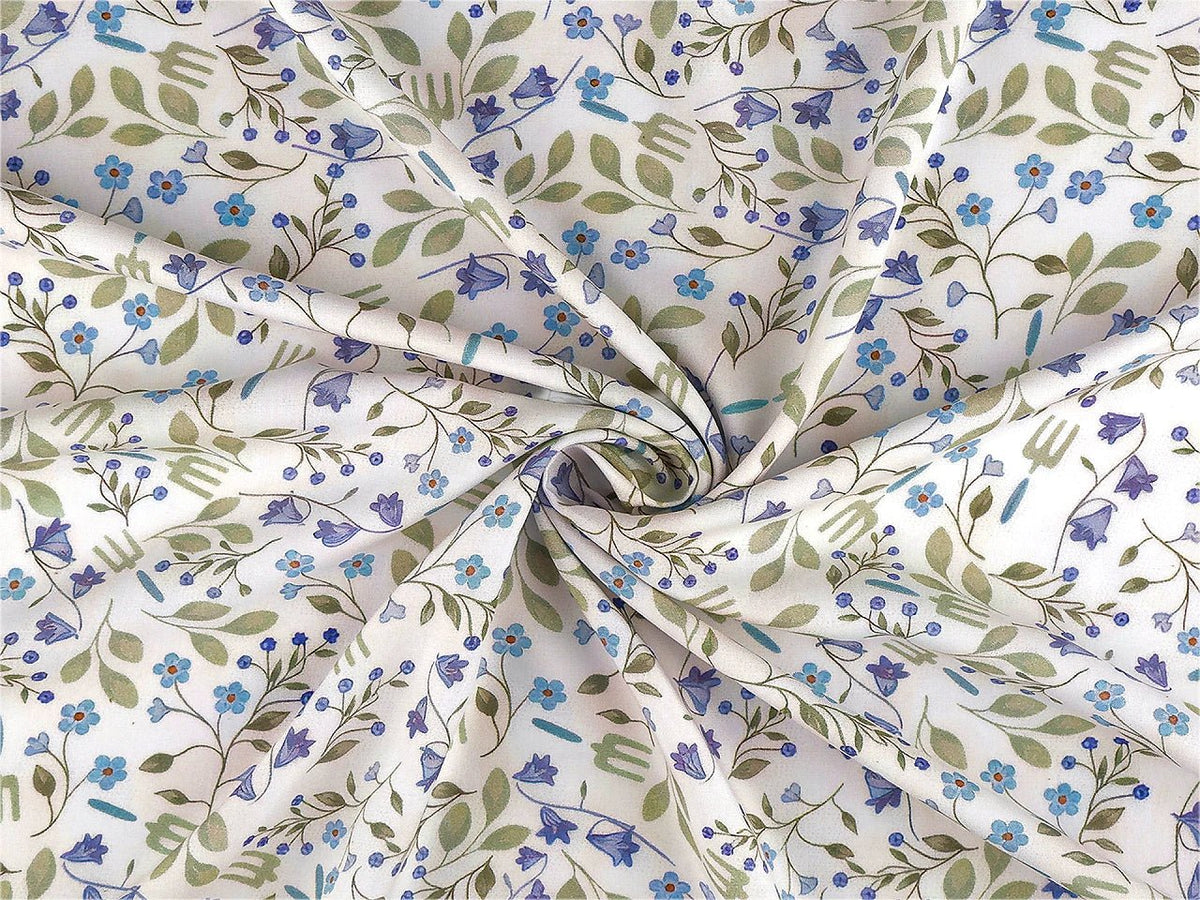Image of premium lightweight 100% cotton fabric with blue flowers – available online at Charlotte Fabrics