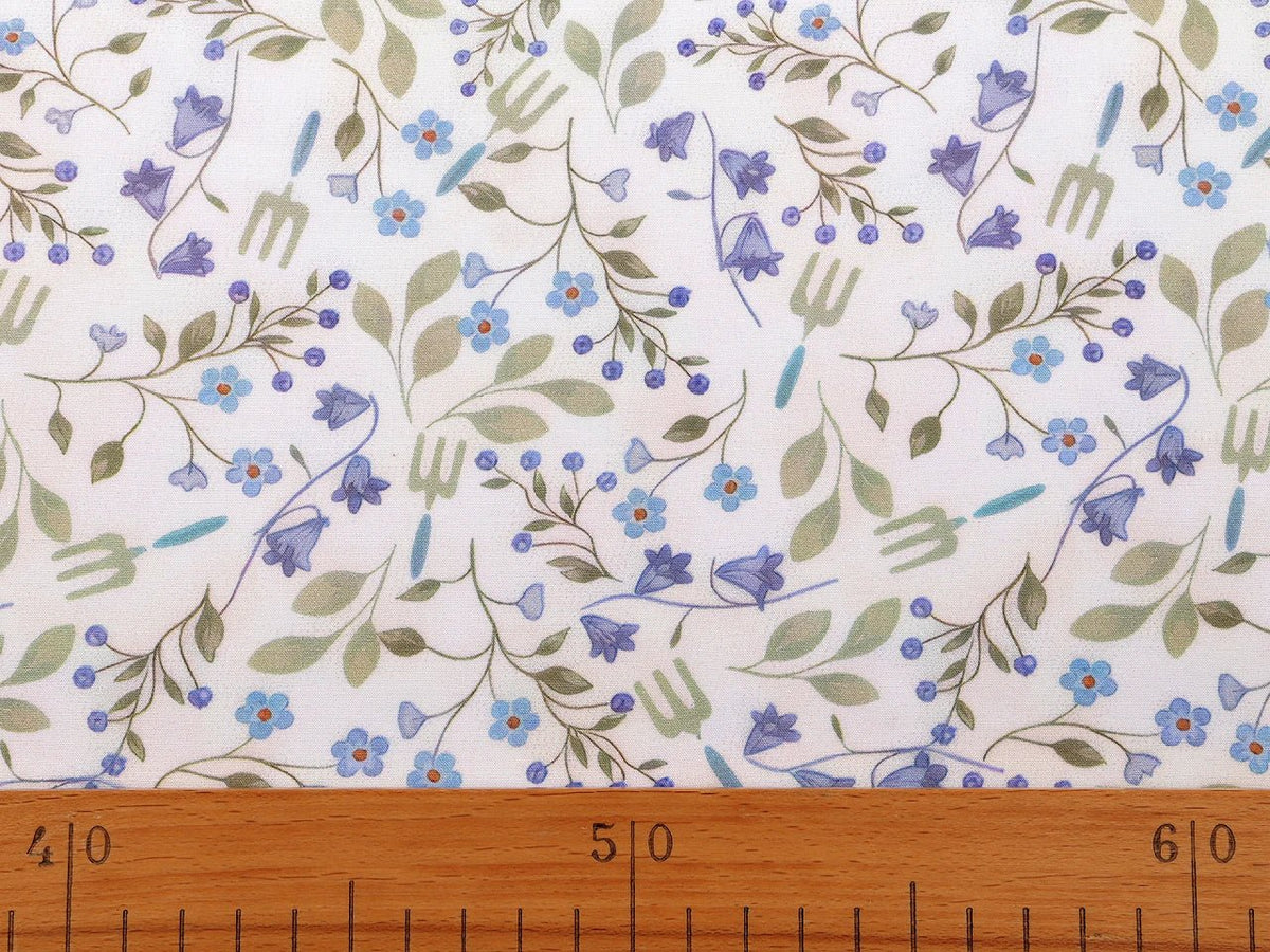 Image of premium lightweight 100% cotton fabric with blue flowers – available online at Charlotte Fabrics