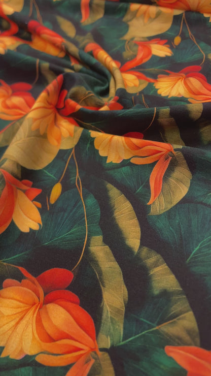 Baumwolljersey – orangefarbene tropische Blumen 250 g/m²