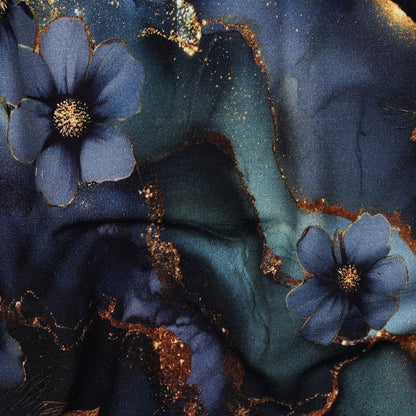 Image of Punto di Roma knit fabric with a blue and gold motif – available online at Charlotte's Fabrics