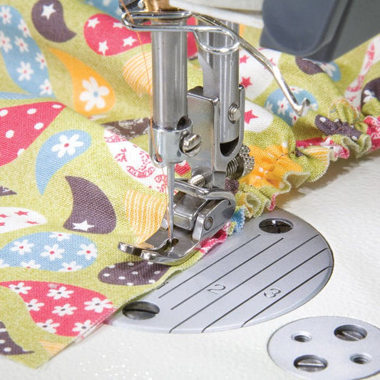 Image of an industrial sewing machine presser foot - adjustable gathering foot – available at Charlotte's Fabrics