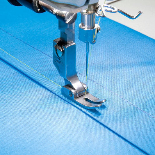 Image of an industrial sewing machine presser foot - for straight stitching – available at Charlotte Fabrics