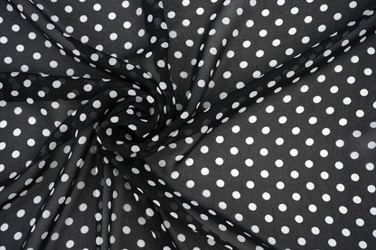 Chiffon - white polka dots on a black background | 150 cm | 65 g/m²