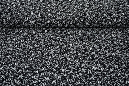 Chiffon à petites fleurs blanches sur fond noir | 150 cm | 65 g/m²