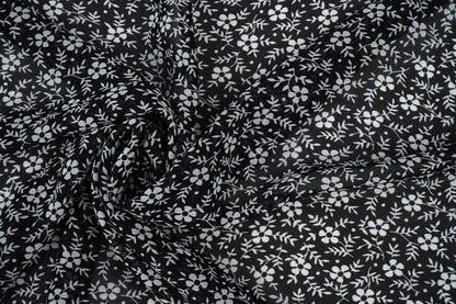 chiffon - petites fleurs blanches sur fond noir | 150 cm | 65 g/m²