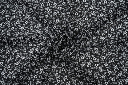 Chiffon - petites fleurs blanches sur fond noir | 150 cm | 65 g/m²
