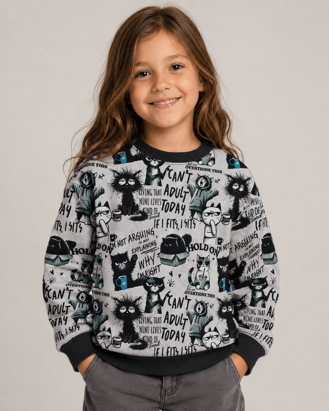 Image with insulated knitwear, Alpenfleece fabric with cats – available online at Šarlotes audumi