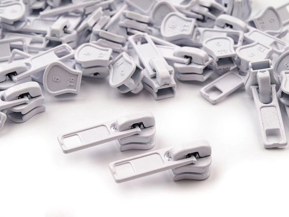 Image avec curseur pour fermeture éclair en plastique n°5, bateau | tons variés – disponible chez Charlote's audumi