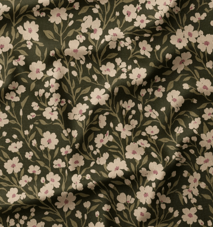 Image of fine cotton corduroy with meadow flowers on a green background – available online at Šarlotes audumi