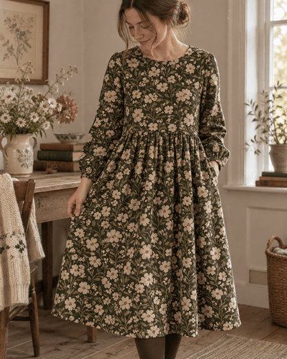 Image of fine cotton corduroy with meadow flowers on a green background – available online at Šarlotes audumi