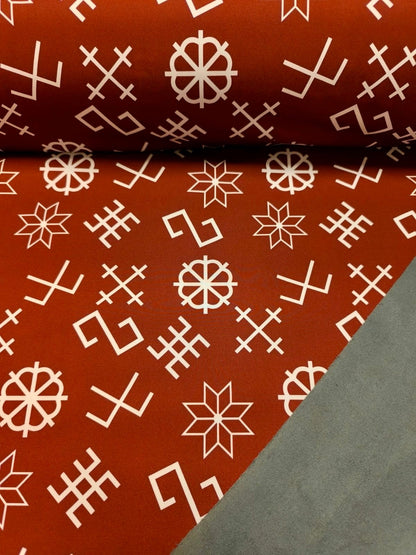 Softshell fabric with Latvian power symbols on a brownish-red background 310 g/m²