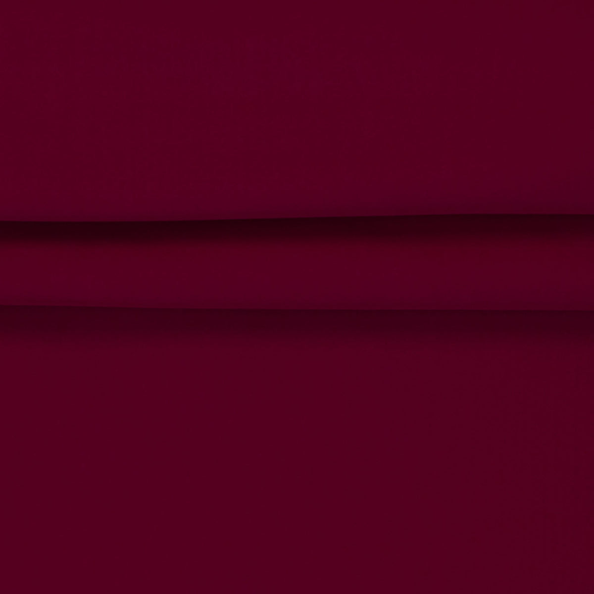 Softshell waterproof fabric in raspberry red – available online at Charlotte's Fabrics