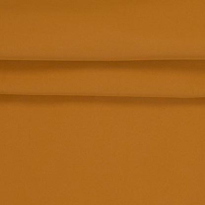 Image with waterproof softshell fabric - ochre yellow, available online at Charlotte's Fabrics